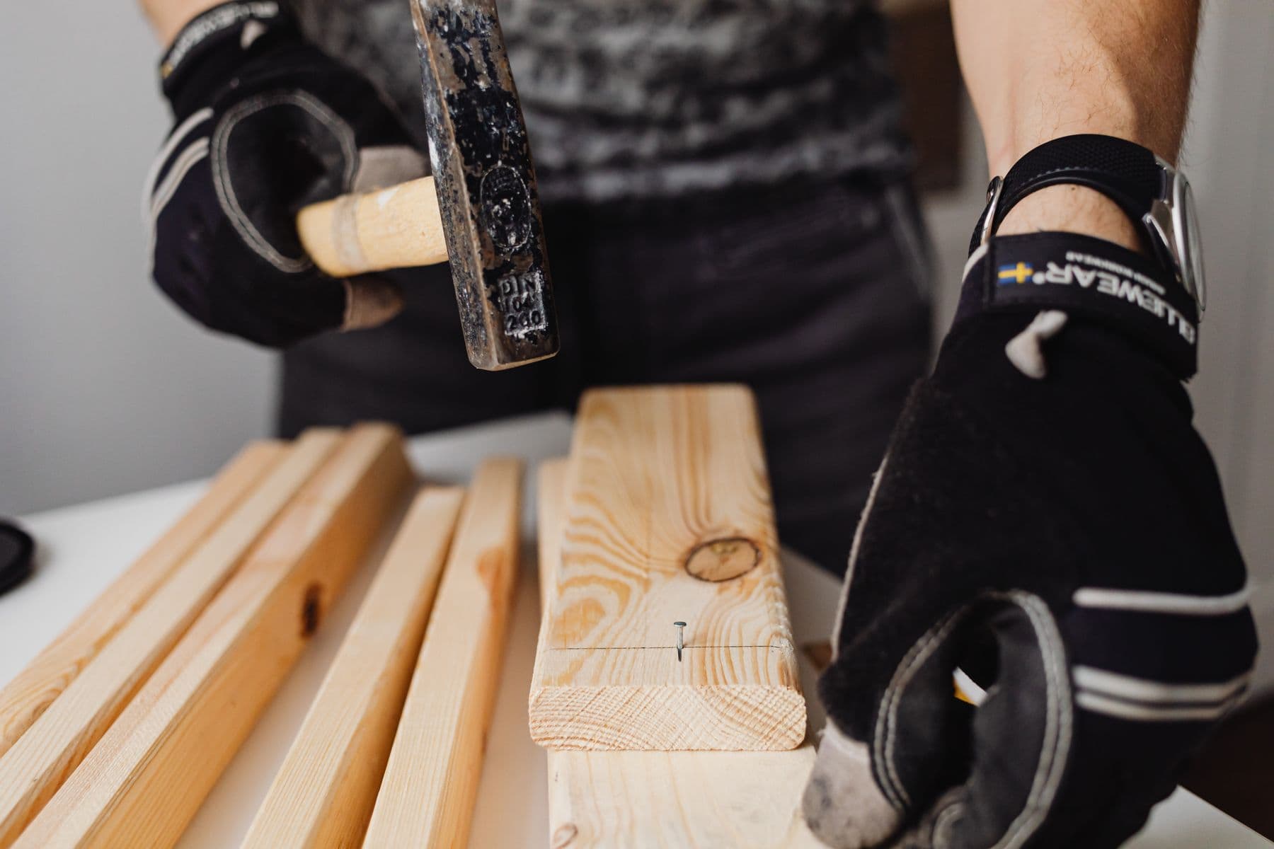 Toolbox and hand tools laid out on a workbench