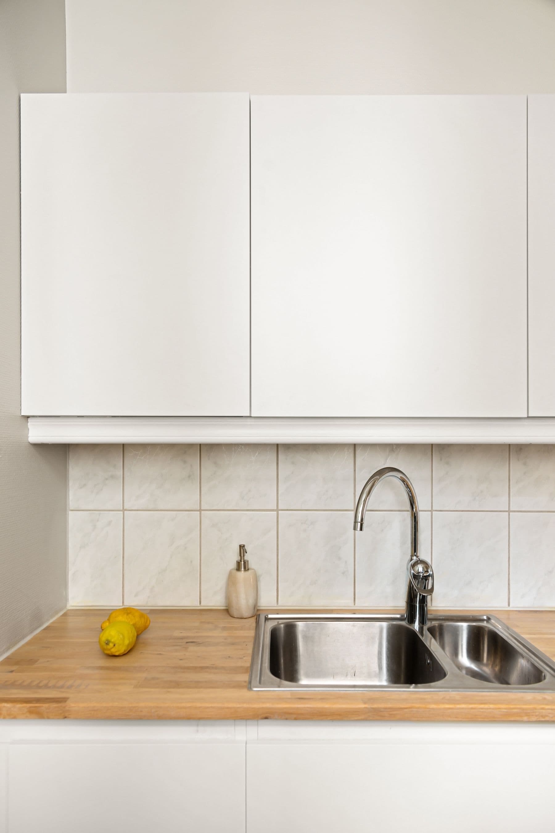 Fitting a washer to a tap with a spanner